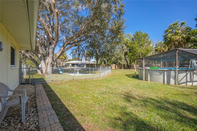 view of yard with a fenced in pool