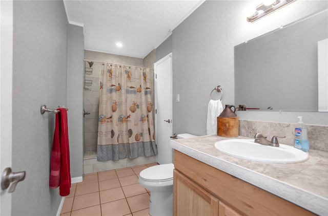 bathroom featuring vanity, tile patterned floors, toilet, and walk in shower