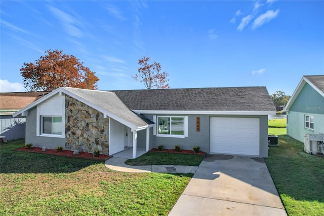 single story home with central AC, a garage, and a front yard