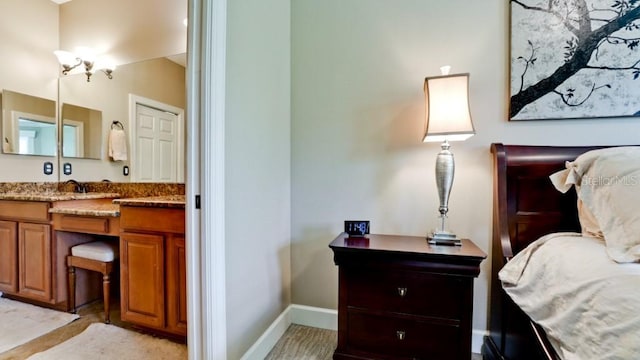 bedroom featuring ensuite bath