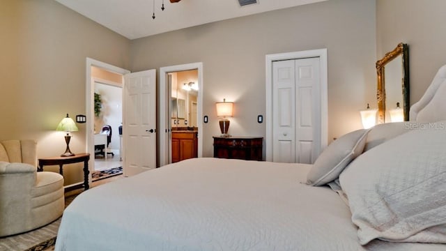 bedroom featuring ceiling fan, ensuite bathroom, and a closet