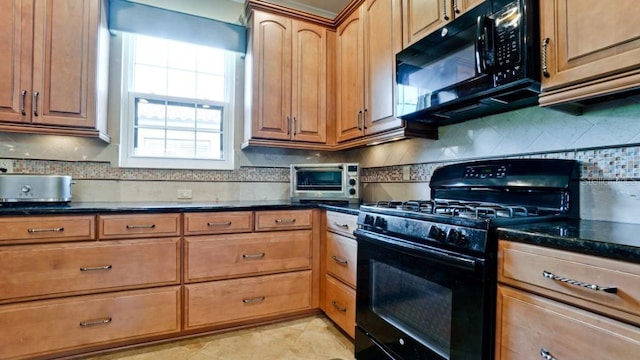 kitchen featuring tasteful backsplash, black appliances, dark stone counters, and light tile patterned flooring