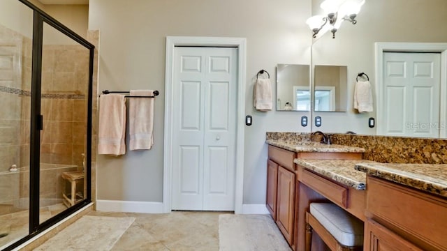 bathroom featuring vanity and a shower with door