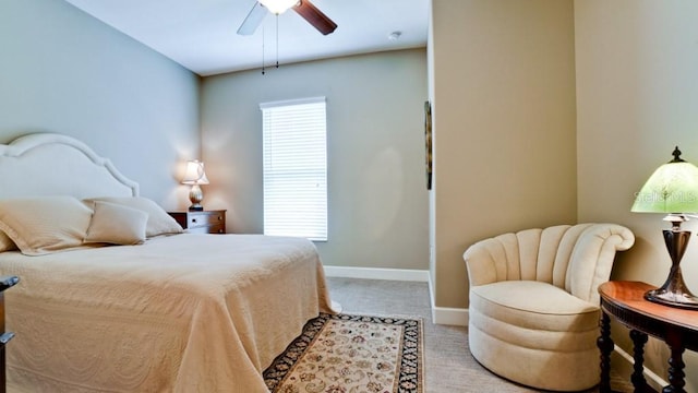 bedroom featuring multiple windows and ceiling fan