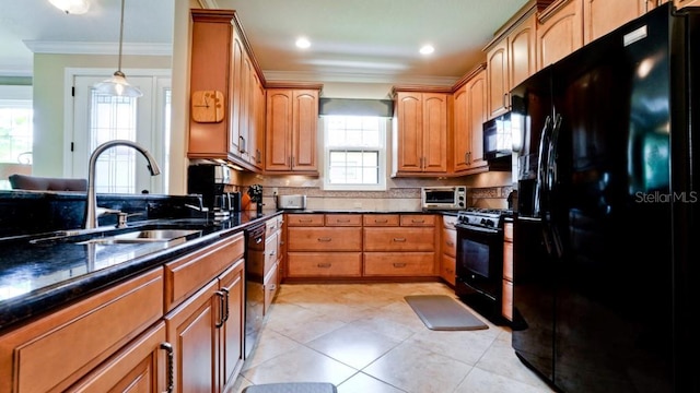 kitchen featuring sink, crown molding, black appliances, pendant lighting, and backsplash