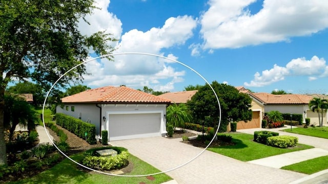 view of front of property featuring a garage, a tile roof, decorative driveway, a front lawn, and stucco siding