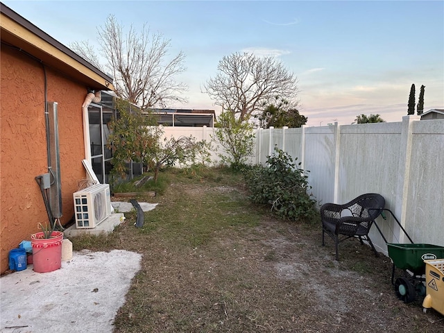 yard at dusk with ac unit