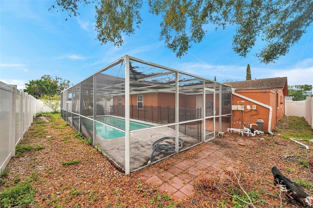 exterior space with a fenced backyard, a fenced in pool, and a patio