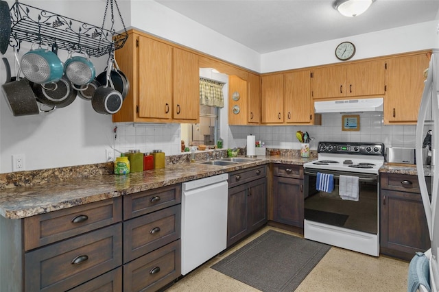 kitchen with white dishwasher, sink, range with electric stovetop, and backsplash