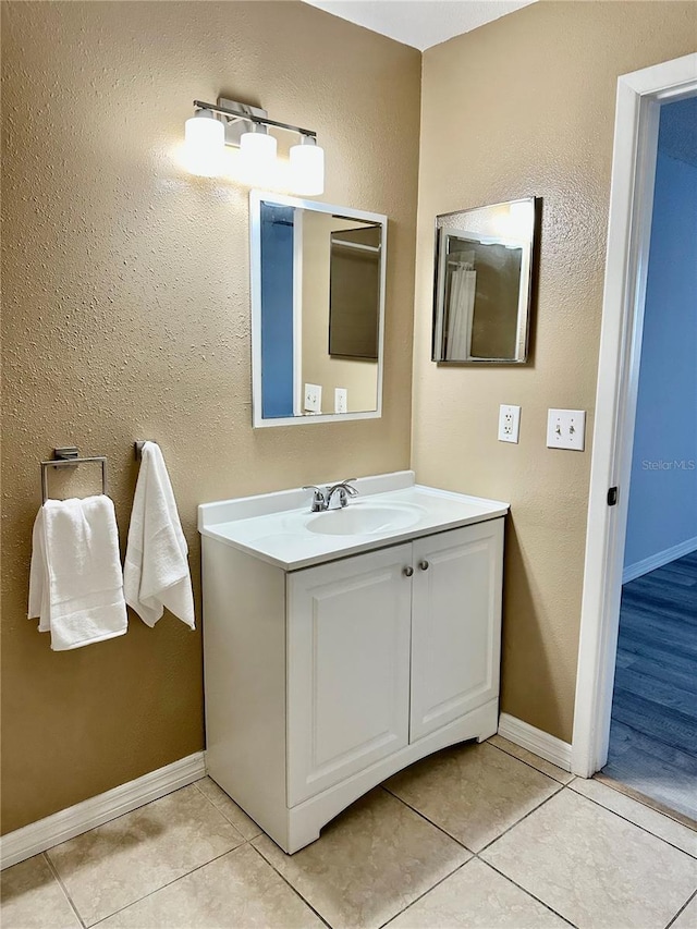 bathroom with vanity and tile patterned floors