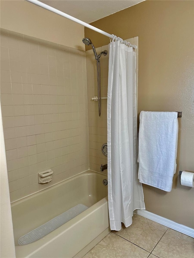 bathroom featuring tile patterned flooring and shower / tub combo