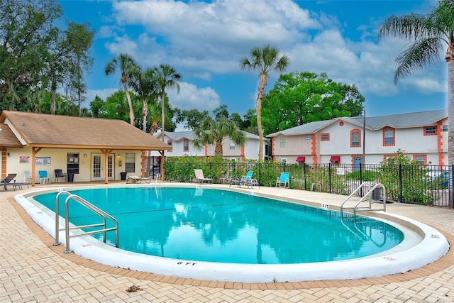 view of swimming pool with a patio