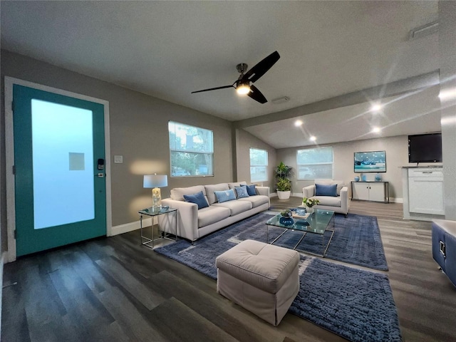 living room with ceiling fan, lofted ceiling, a textured ceiling, and dark hardwood / wood-style flooring