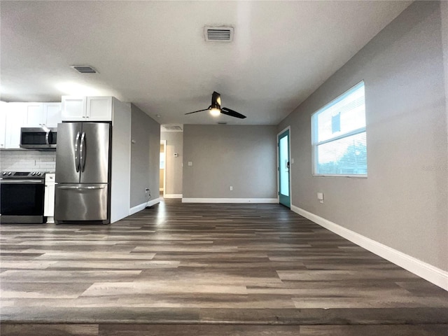 unfurnished living room with ceiling fan and hardwood / wood-style floors