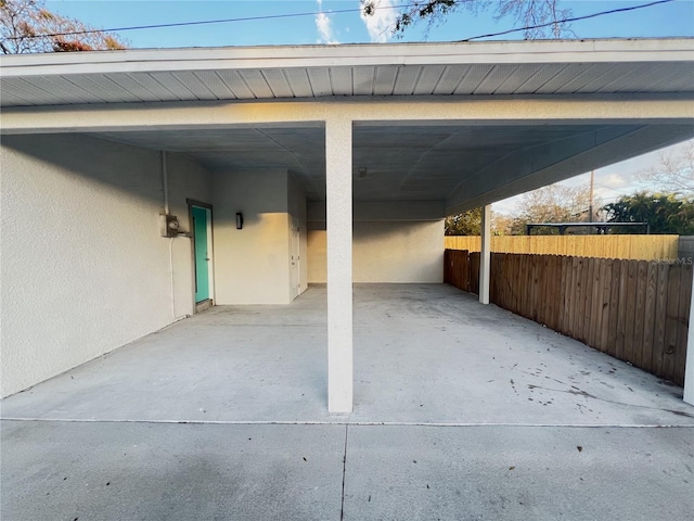 view of vehicle parking with a carport