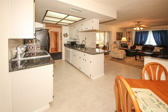 kitchen with ceiling fan, white dishwasher, sink, and white cabinets