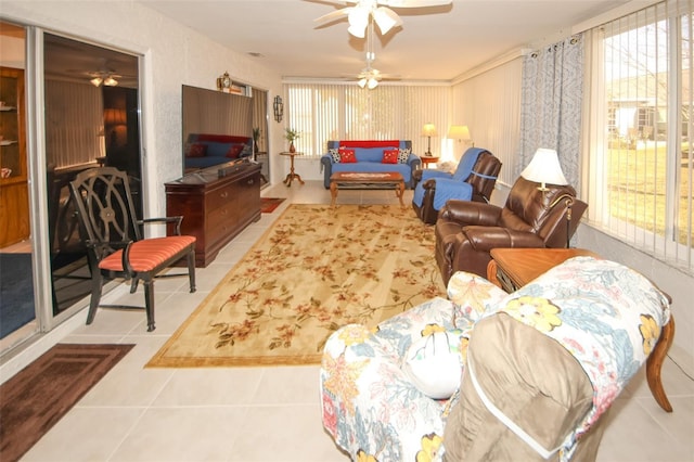 living room featuring tile patterned flooring and ceiling fan