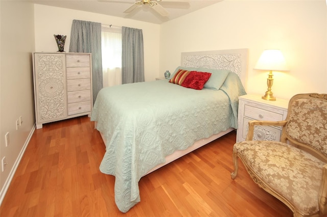 bedroom featuring hardwood / wood-style flooring and ceiling fan