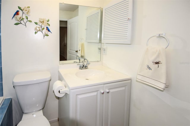 bathroom with toilet and vanity