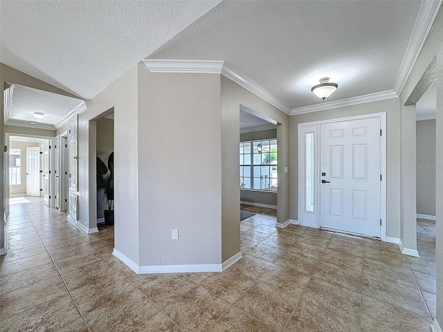 foyer featuring crown molding and a textured ceiling