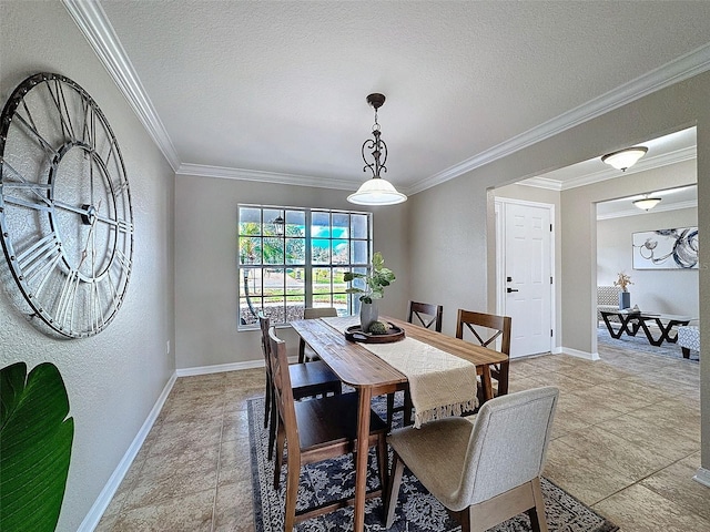 dining area featuring ornamental molding and a textured ceiling