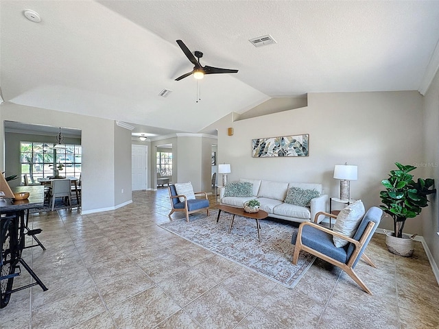 living room with ceiling fan, a textured ceiling, and lofted ceiling