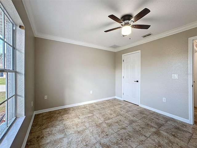 unfurnished room featuring ceiling fan and crown molding