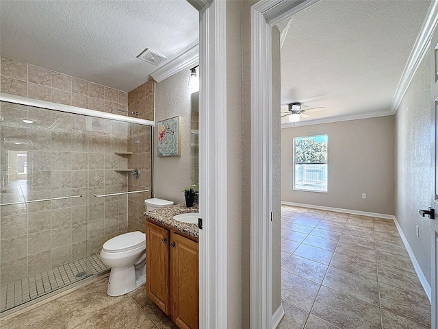 bathroom featuring a shower with shower door, toilet, a textured ceiling, vanity, and crown molding