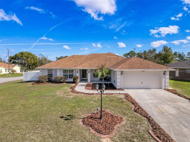 ranch-style home with a front yard and a garage