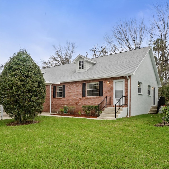 view of front of property with brick siding, a shingled roof, and a front lawn