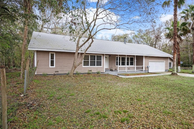 ranch-style home featuring a garage, driveway, a porch, and a front yard