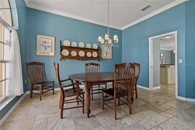 dining room with stone tile floors, visible vents, ornamental molding, a textured ceiling, and baseboards