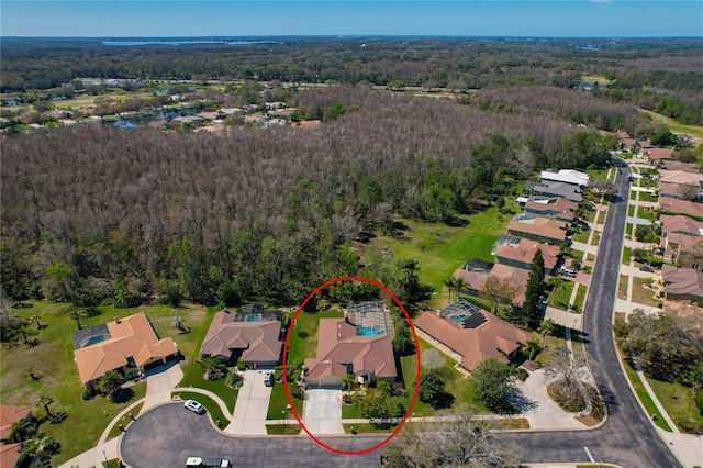 aerial view with a forest view and a residential view