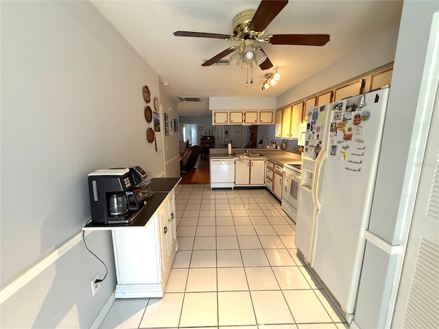 kitchen featuring ceiling fan, light tile patterned floors, and white appliances