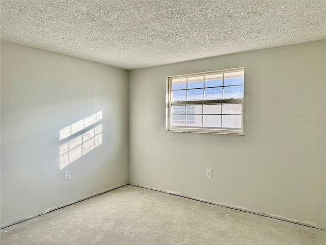 spare room featuring a textured ceiling