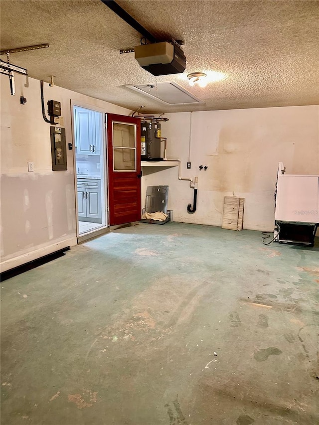 garage featuring a garage door opener, electric panel, and electric water heater