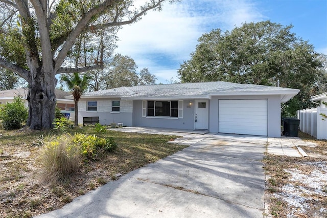 ranch-style home featuring a garage