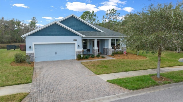 craftsman-style house featuring a garage and a front yard