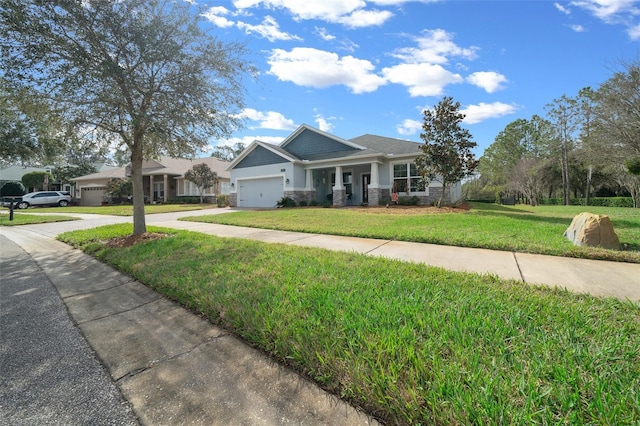 view of front of property featuring a front lawn and a garage