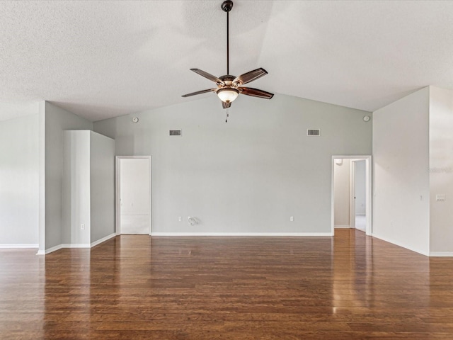 empty room with dark wood-style flooring, visible vents, ceiling fan, and a textured ceiling