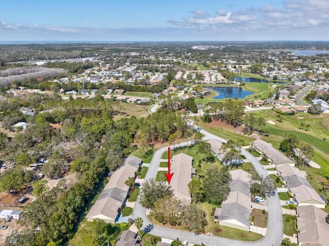 birds eye view of property featuring a water view and a residential view