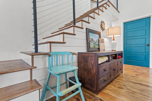 staircase with wood finished floors