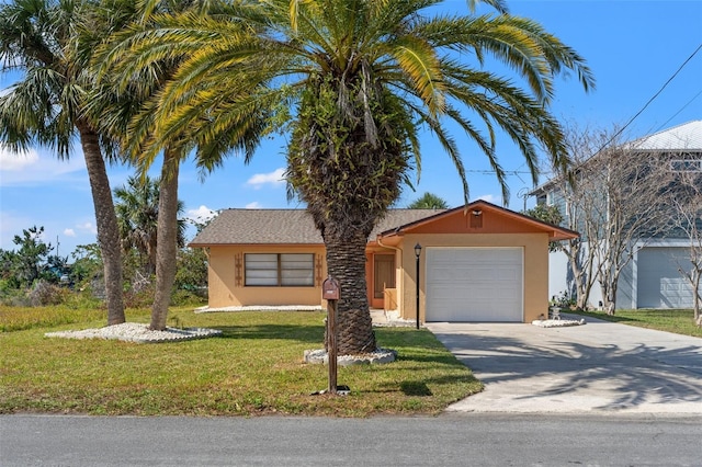 ranch-style house featuring driveway, an attached garage, a front lawn, and stucco siding