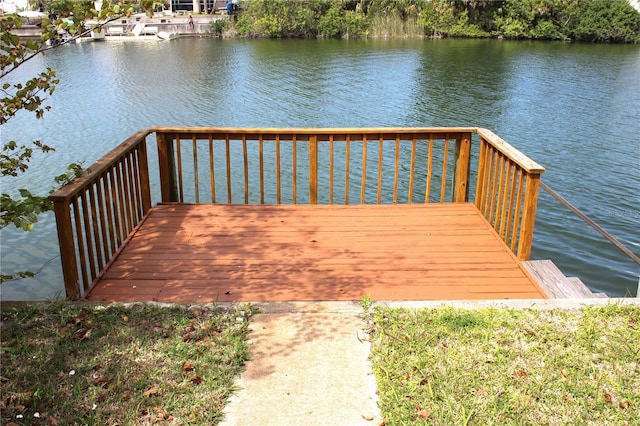 view of dock with a deck with water view