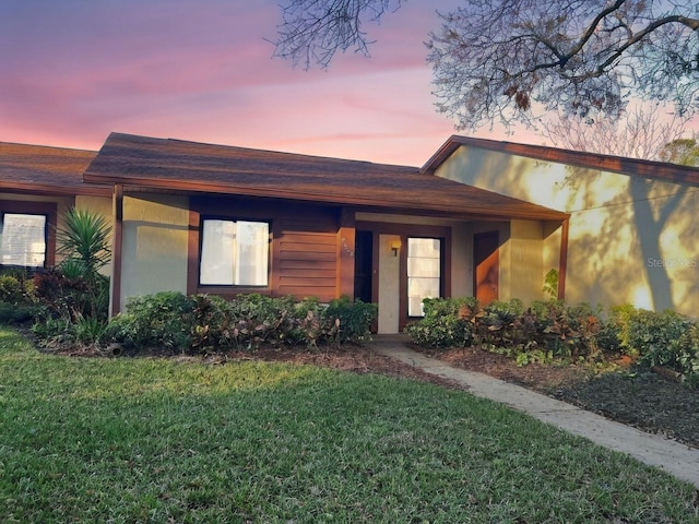 view of front of home with a yard