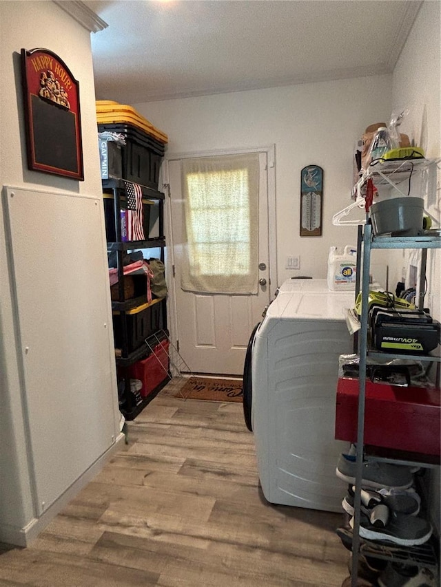 washroom featuring light hardwood / wood-style flooring and washing machine and dryer