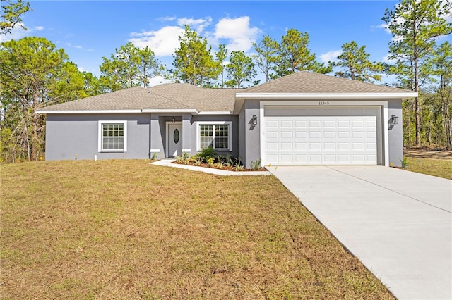 ranch-style house featuring a front lawn and a garage