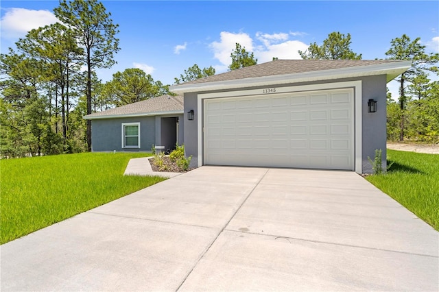 11345 Thrasher Ave, Weeki Wachee, FL 34614 - single story home featuring stucco siding, a front lawn, driveway, and a garage
