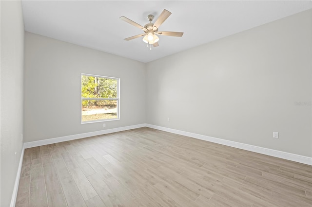 11345 Thrasher Ave, Weeki Wachee, FL 34614 - spare room featuring light wood finished floors, baseboards, and ceiling fan