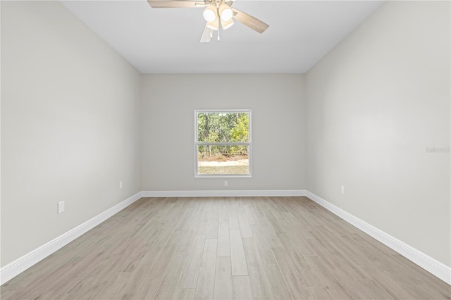 11345 Thrasher Ave, Weeki Wachee, FL 34614 - spare room featuring light wood-style floors, a ceiling fan, and baseboards